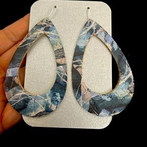 Large leather cutout earrings. Blue print $15